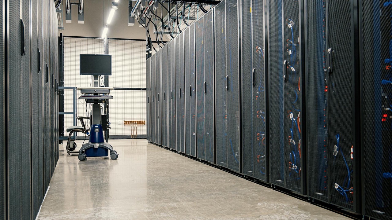 Professional data center with server racks and monitoring station representing managed cloud infrastructure and endpoint deployment